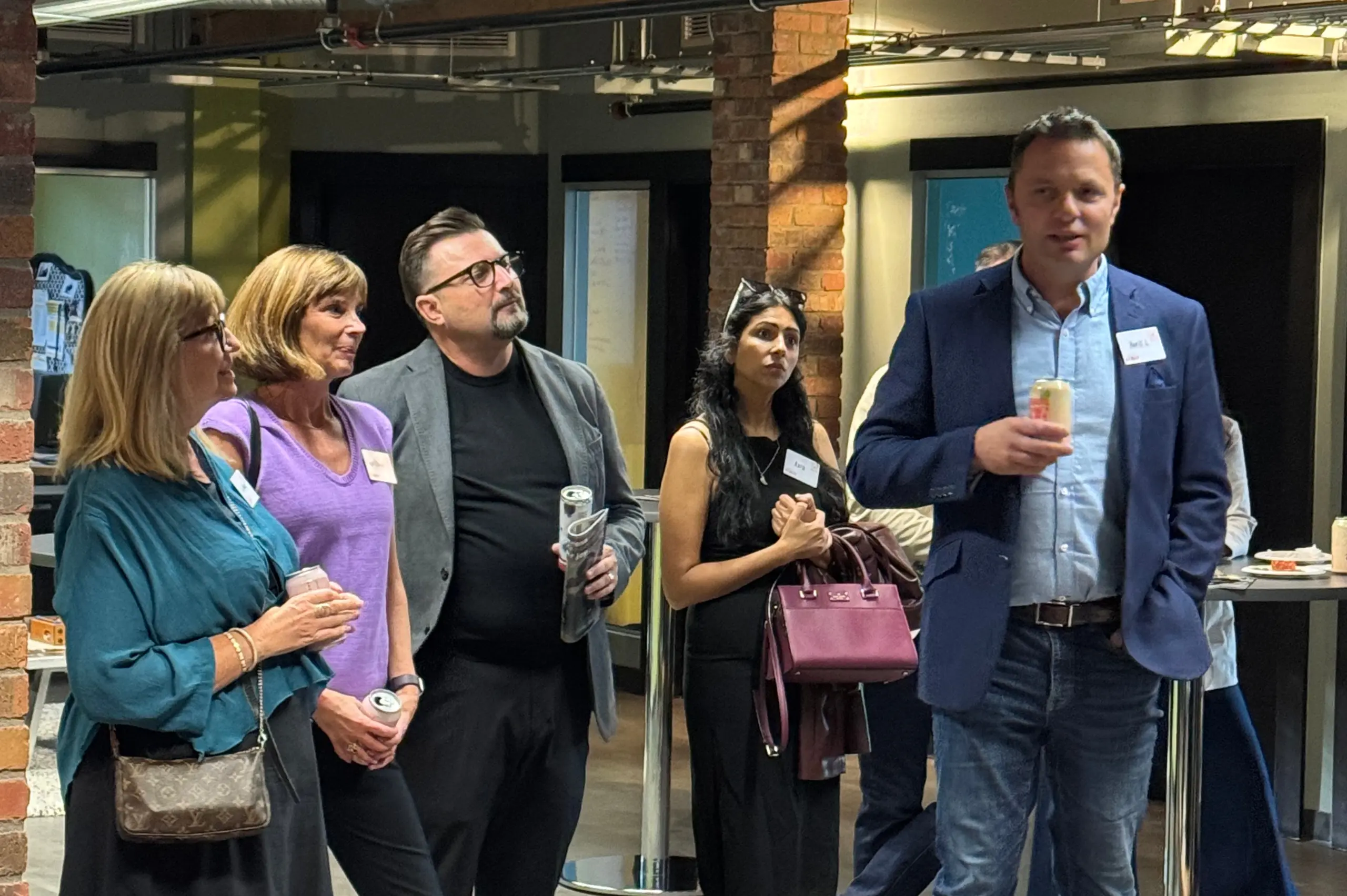 business people networking and holding drinks at an event