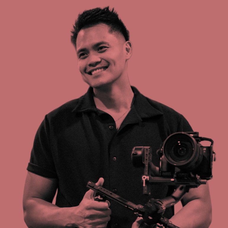 Filmmaker smiles holding professional camera gimbal with Sony camera