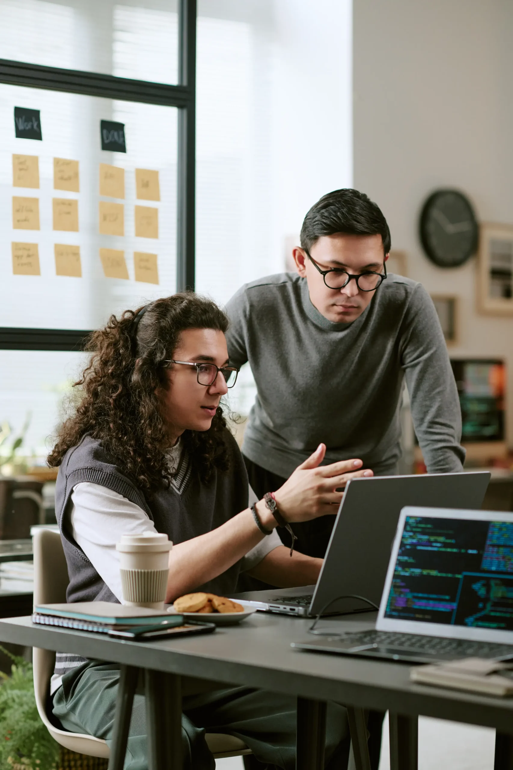 collaborative-team-looking-at-code-on-laptop-scree-2026-01-21-02-59-42-utc