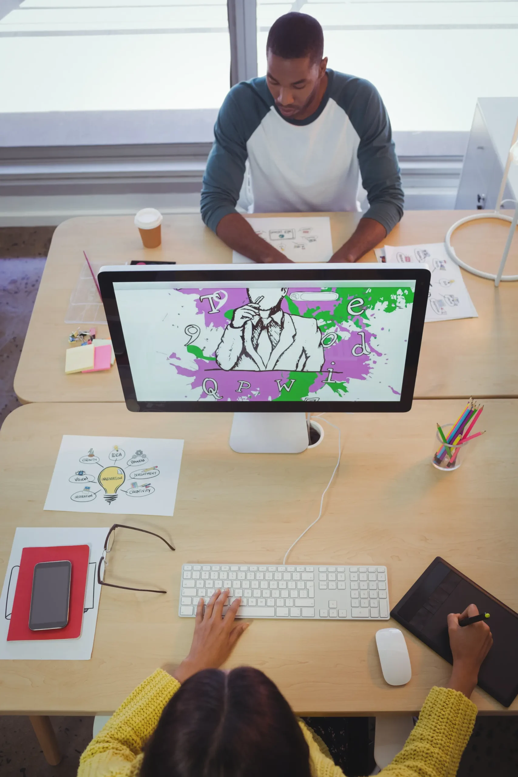 male-and-female-designer-working-in-creative-offic-2026-03-25-08-23-09-utc