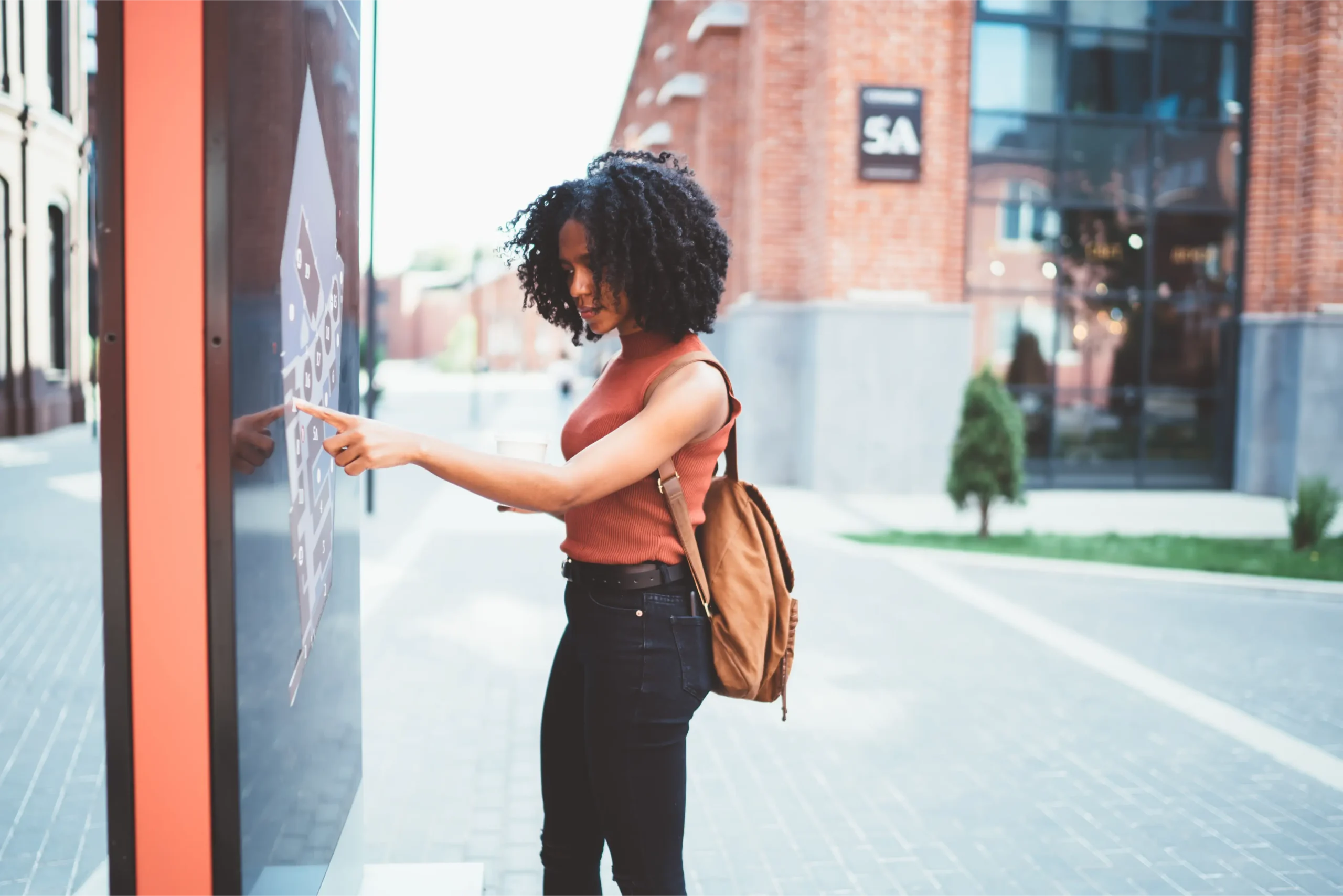 young-woman-uses-interactive-urban-map-display-2026-01-09-08-30-21-utc